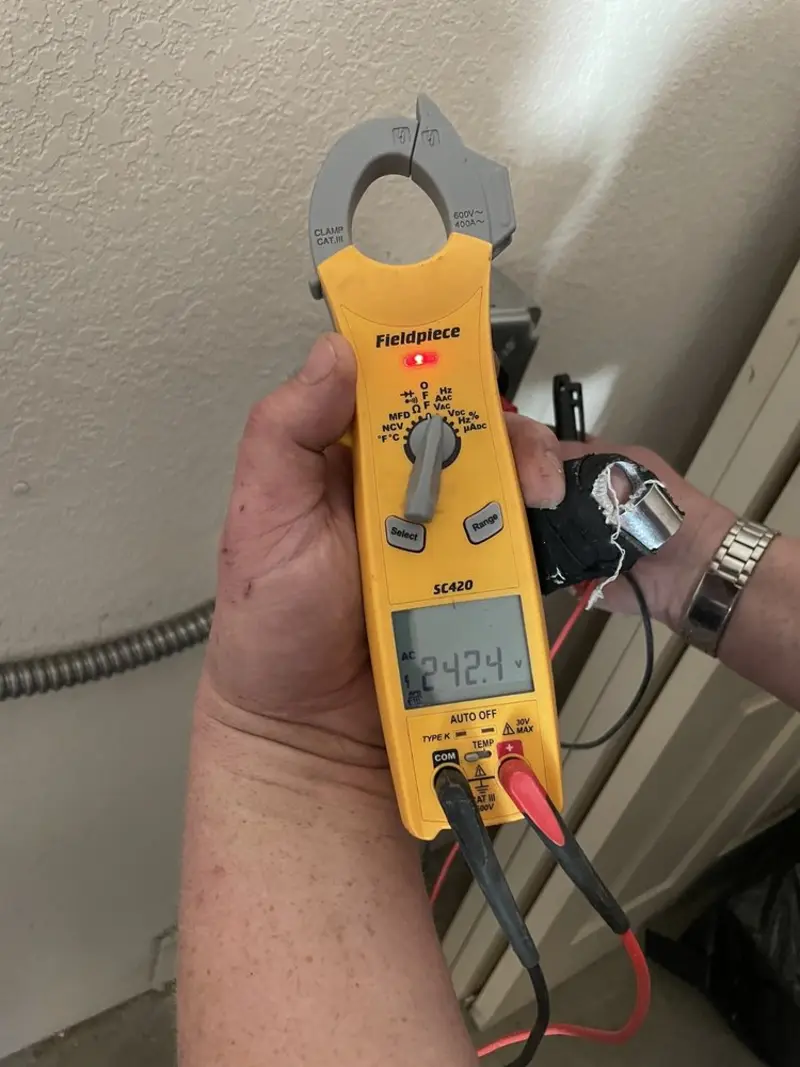 Voltage testing with clamp meter during Hot Tub / Pool Electrical Wiring in Crete